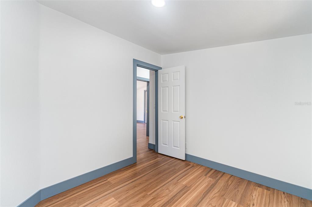 4664 Southwest 181st Court Dunnellon, FL 34432 - Photo 13 of 46 a view of an empty room with wooden floor