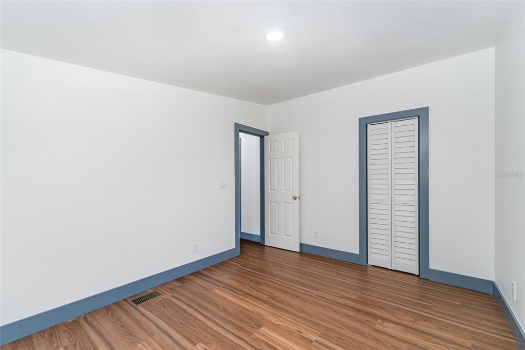4664 Southwest 181st Court Dunnellon, FL 34432 - Photo 17 of 46 a view of an empty room with wooden floor and closet