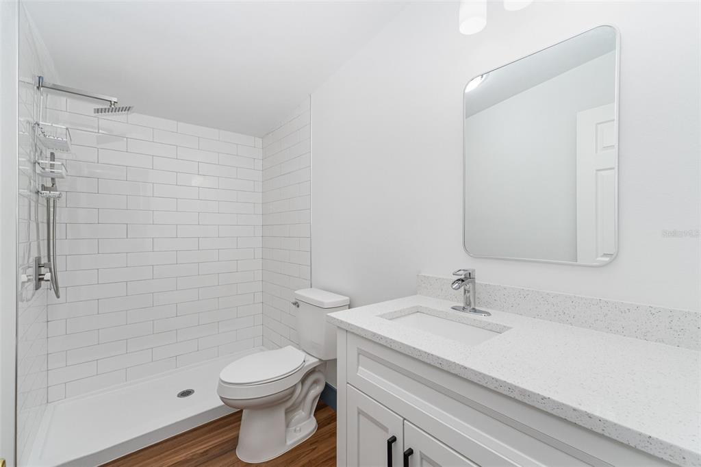 4664 Southwest 181st Court Dunnellon, FL 34432 - Photo 19 of 46 a bathroom with a sink a toilet and shower