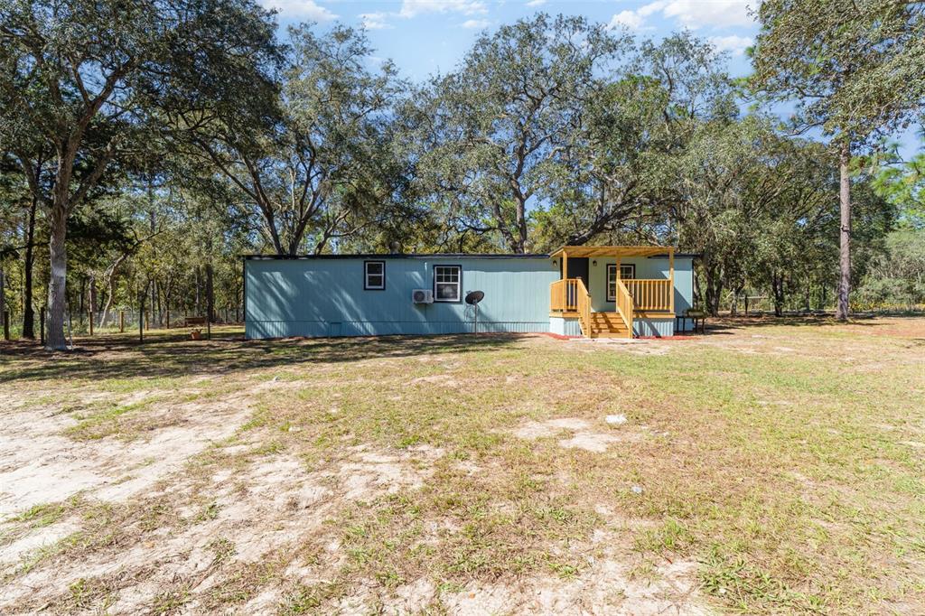 4664 Southwest 181st Court Dunnellon, FL 34432 - Photo 21 of 46 a view of a house with snow on the road