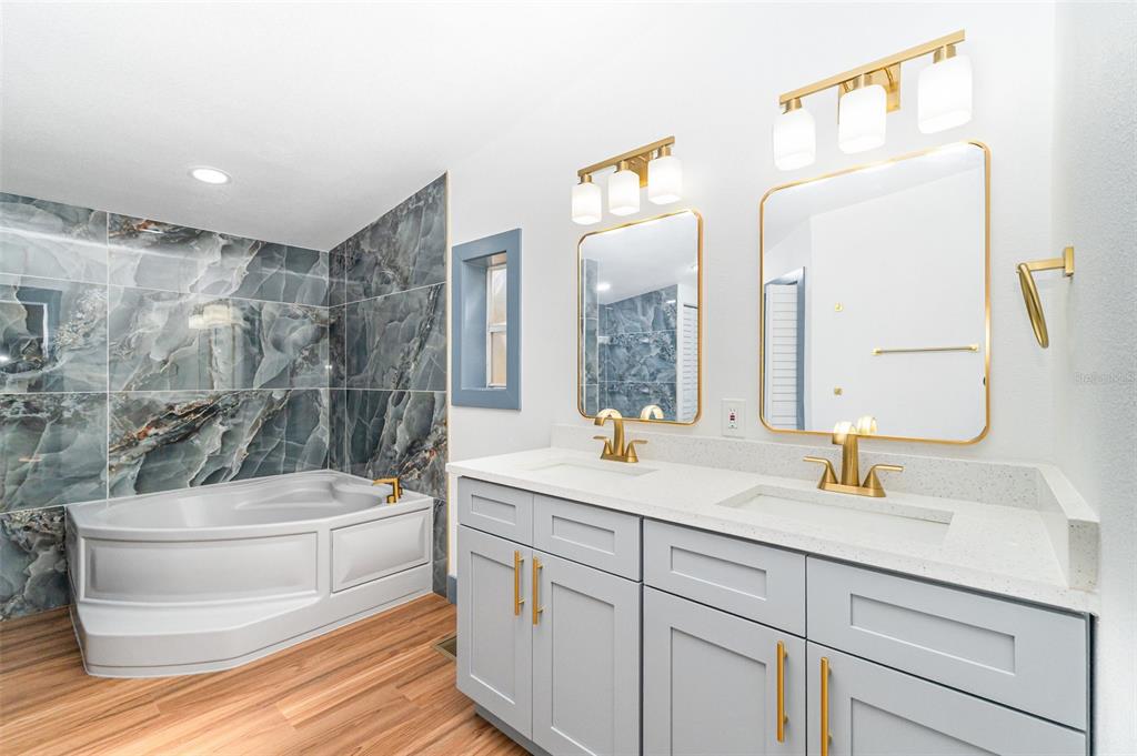 4664 Southwest 181st Court Dunnellon, FL 34432 - Photo 10 of 46 a bathroom with a sink a toilet a mirror and shower