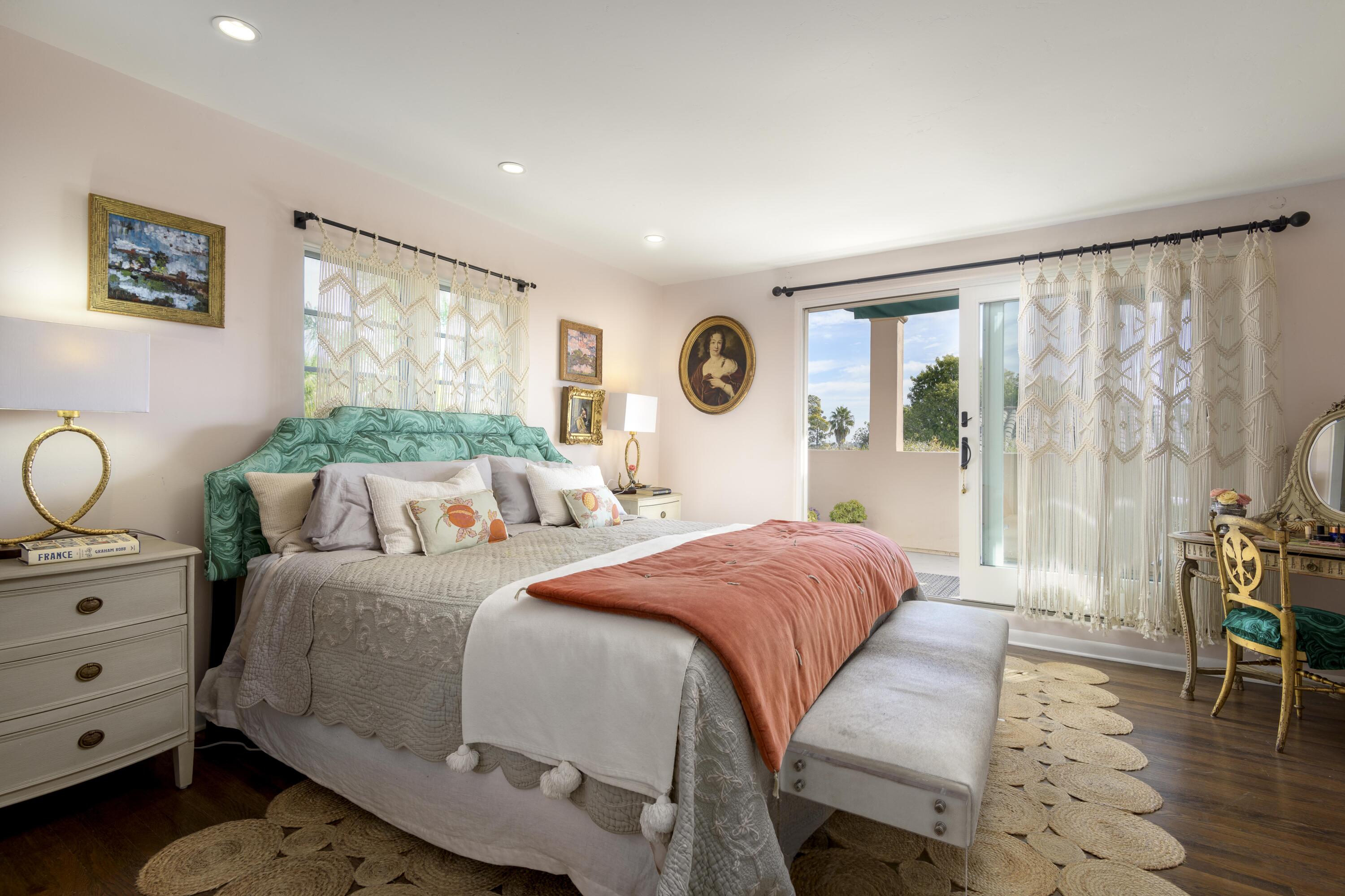 1318 Alta Vista Road Santa Barbara, CA 93103 - Photo 21 of 44 a bedroom with a bed and wooden floor