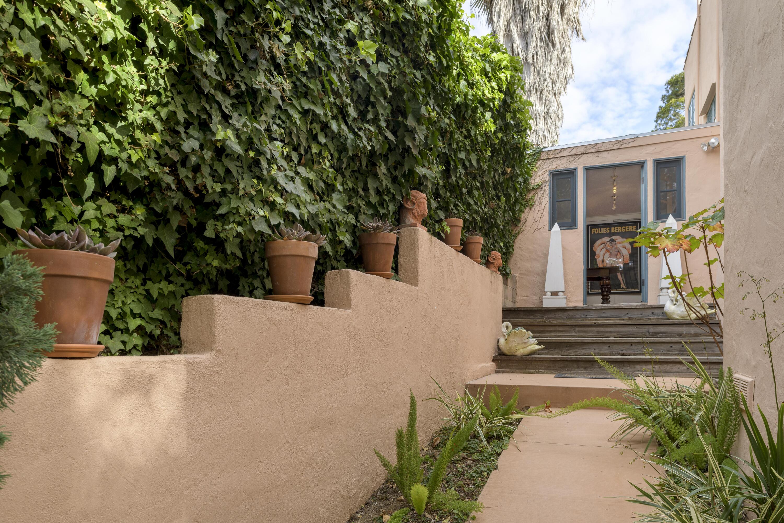 1318 Alta Vista Road Santa Barbara, CA 93103 - Photo 29 of 44 a view of a house with potted plants