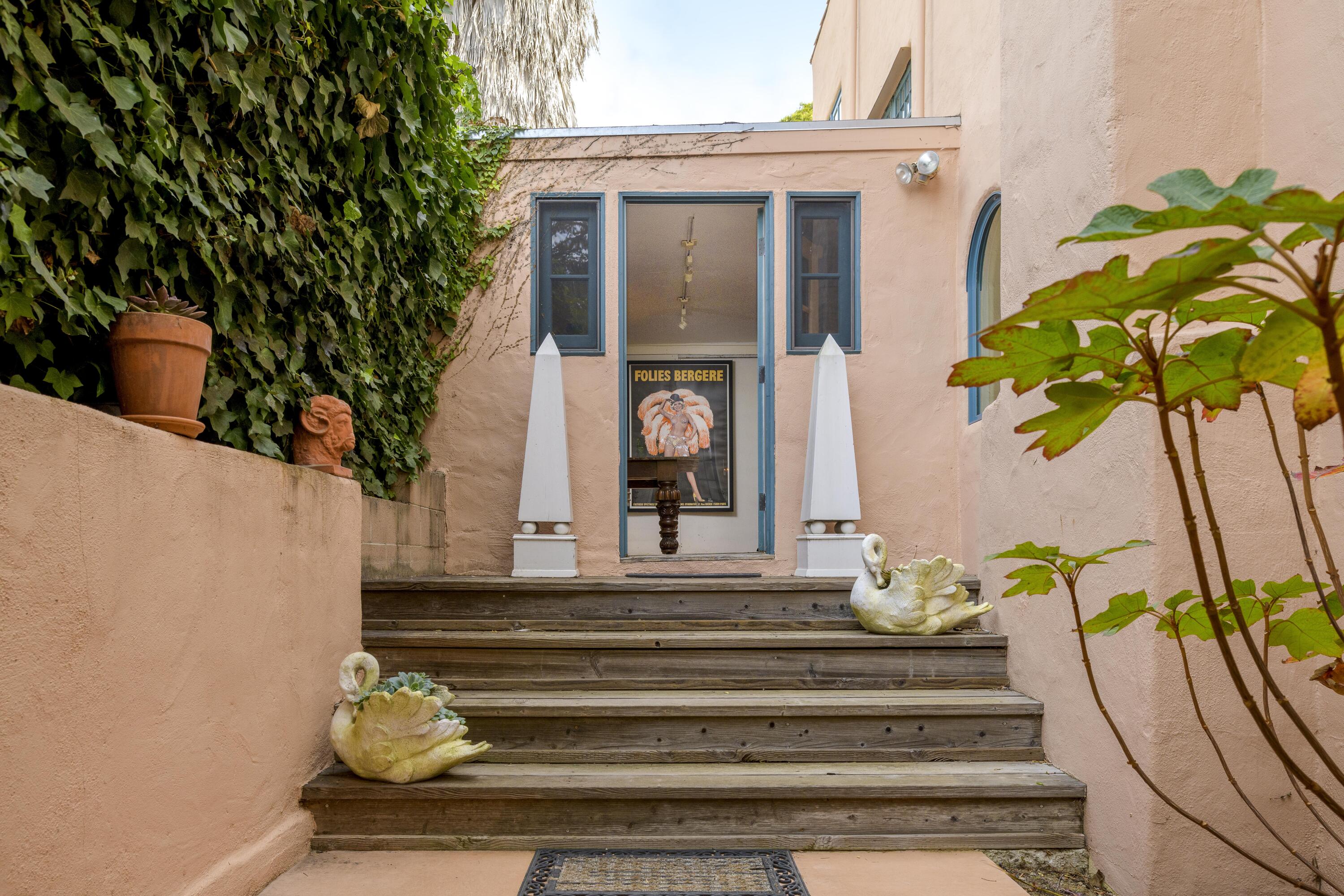 1318 Alta Vista Road Santa Barbara, CA 93103 - Photo 30 of 44 a front view of a house with potted plants