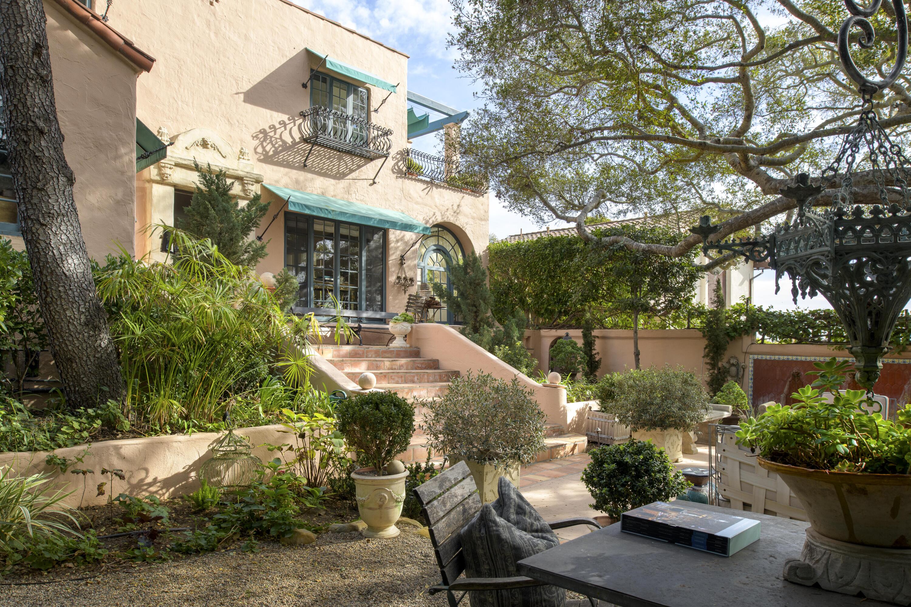 1318 Alta Vista Road Santa Barbara, CA 93103 - Photo 34 of 44 a view of a chairs and table in a backyard