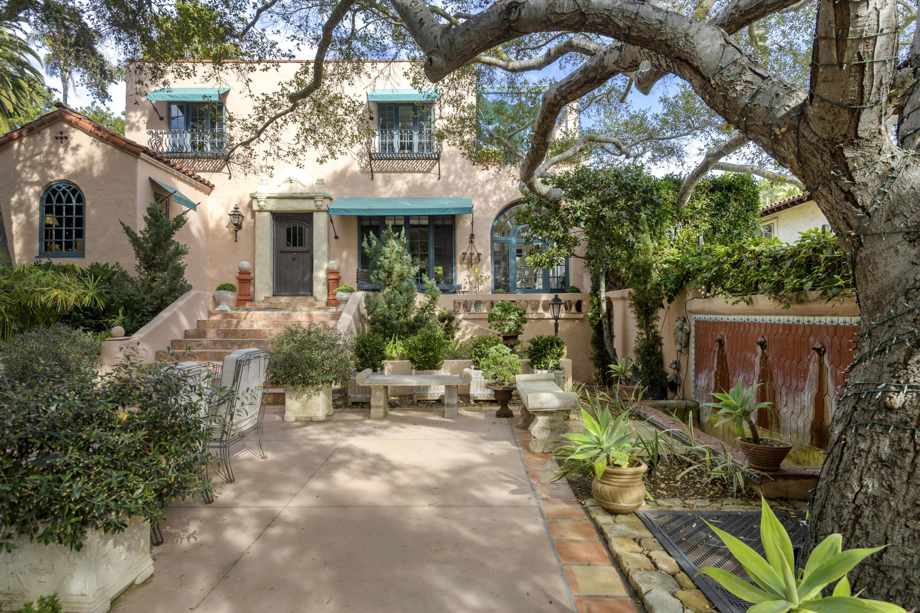 1318 Alta Vista Road Santa Barbara, CA 93103 - Photo 38 of 44 a view of a patio with table and chairs and potted plants
