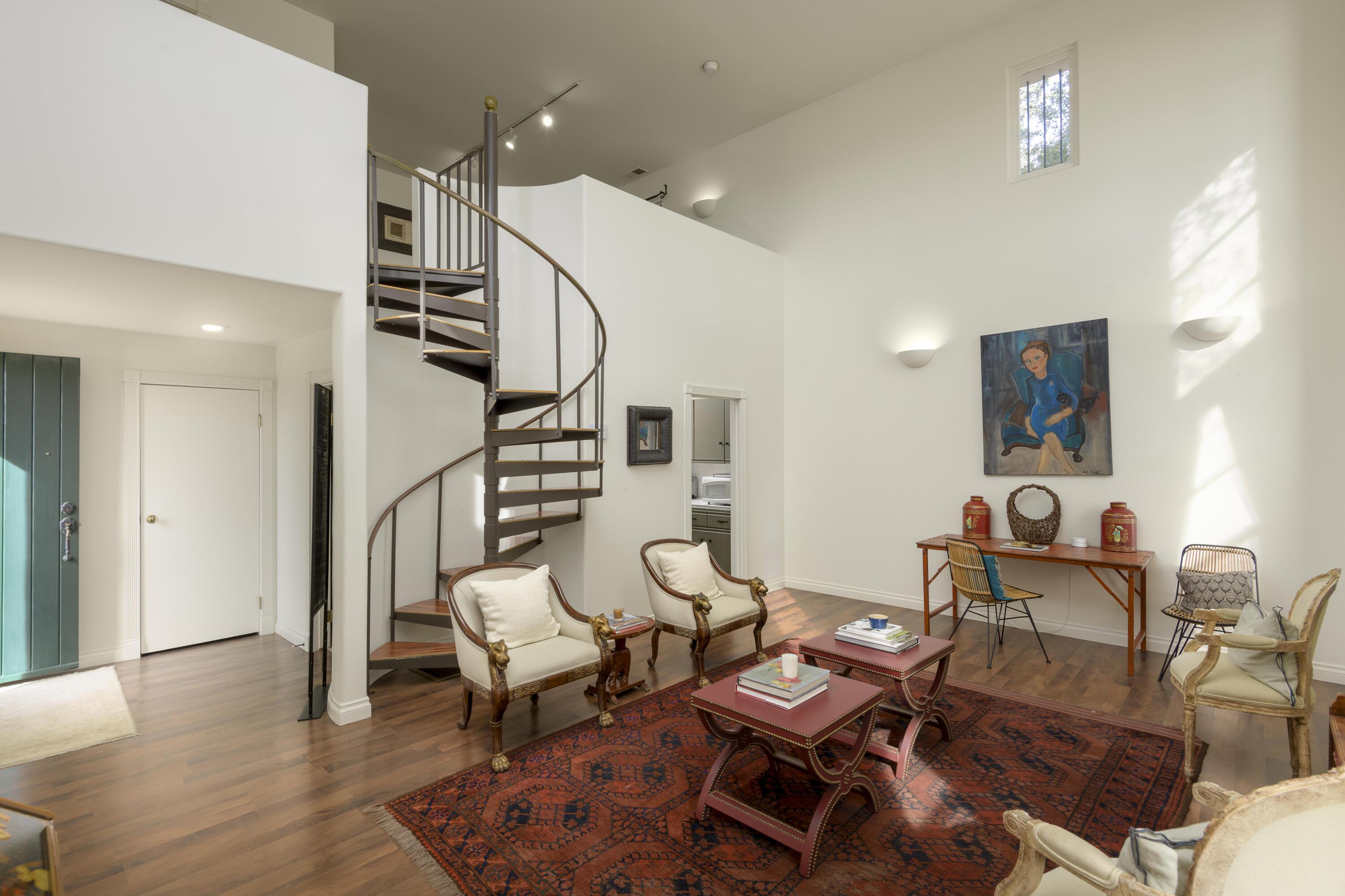 1318 Alta Vista Road Santa Barbara, CA 93103 - Photo 41 of 44 a living room with couches chairs and kitchen view with wooden floor