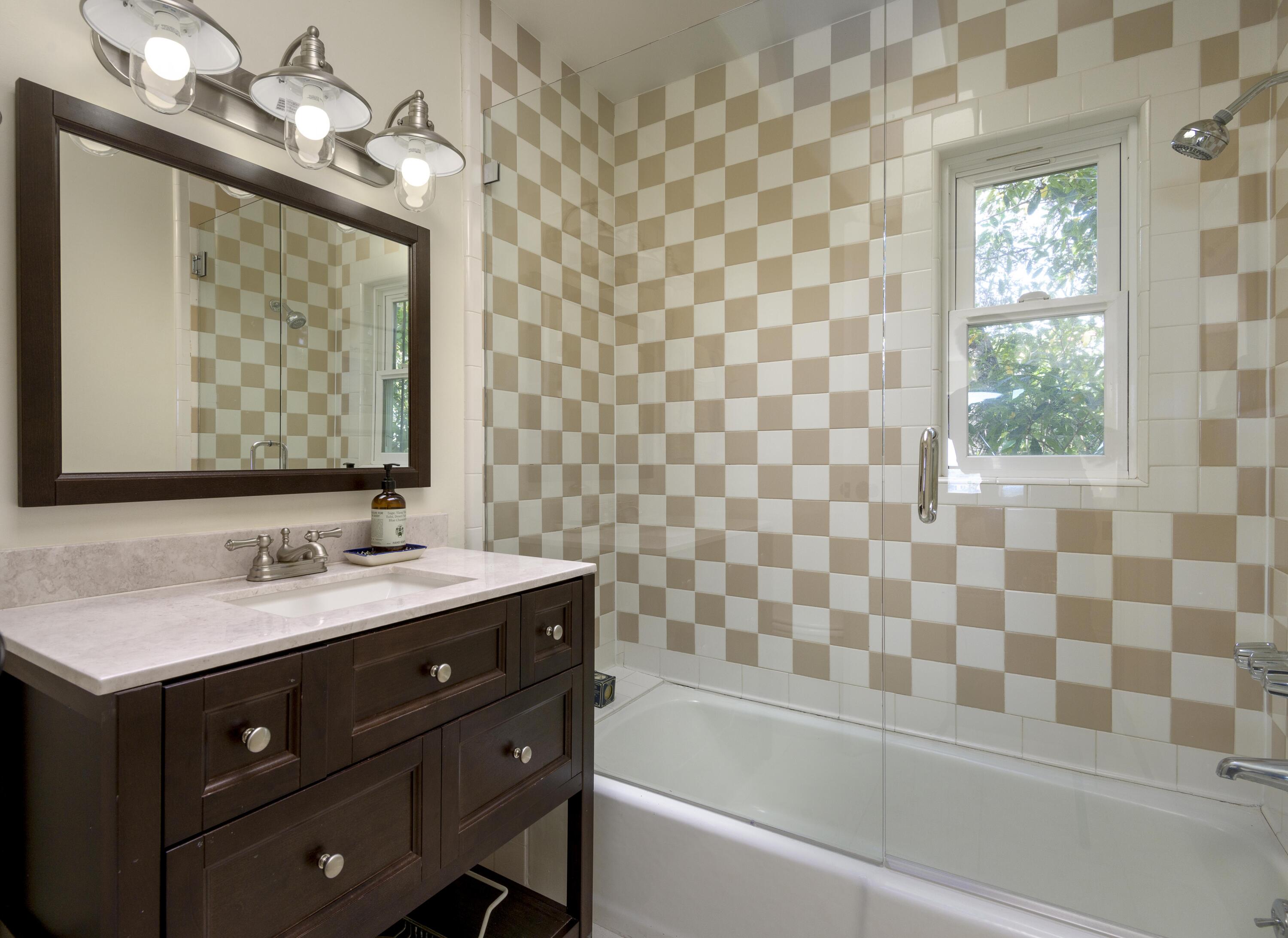 1318 Alta Vista Road Santa Barbara, CA 93103 - Photo 43 of 44 a bathroom with a sink and a mirror