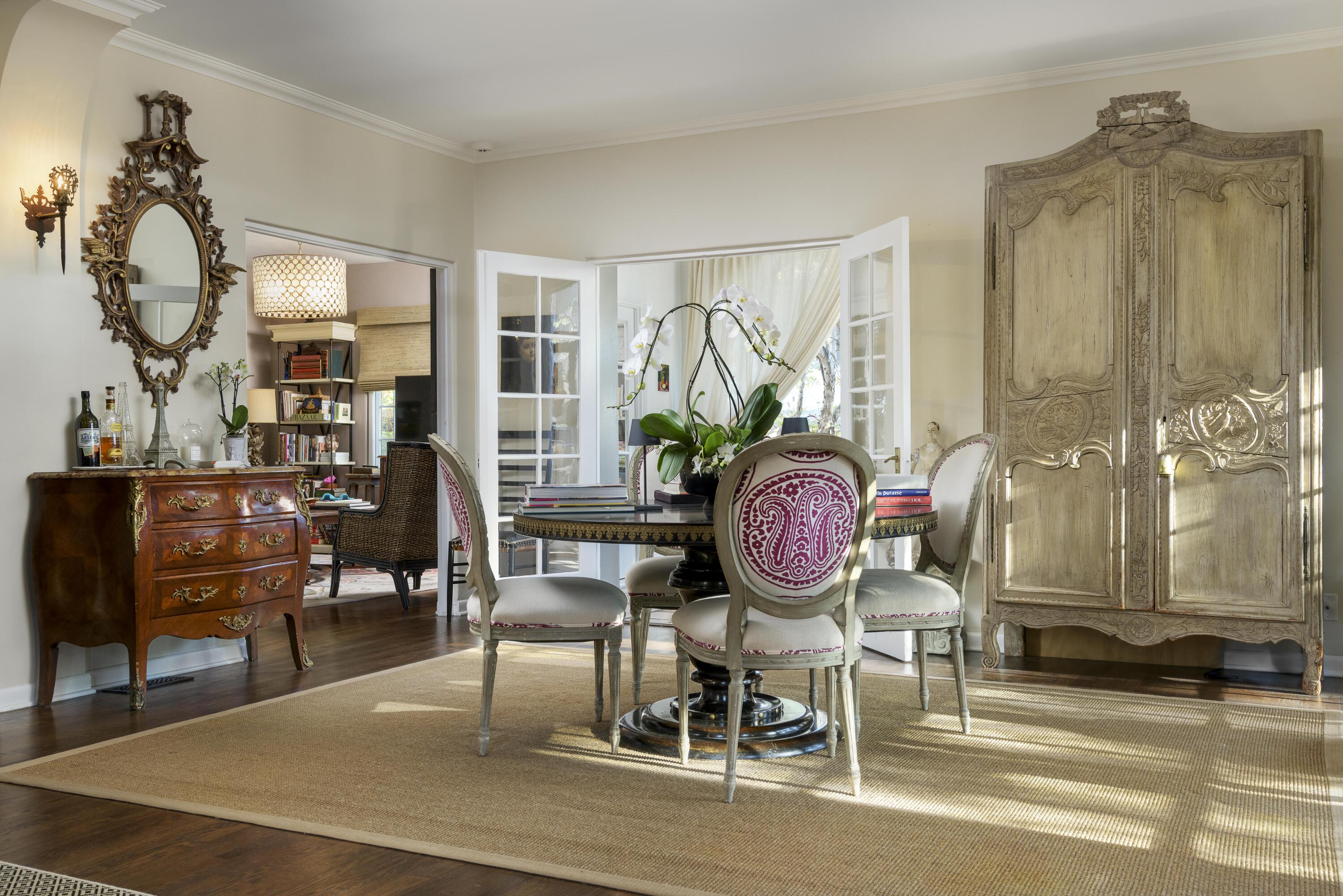 1318 Alta Vista Road Santa Barbara, CA 93103 - Photo 8 of 44 a living room with furniture a rug and a chandelier