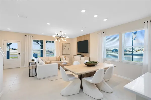 a dining room with furniture and window