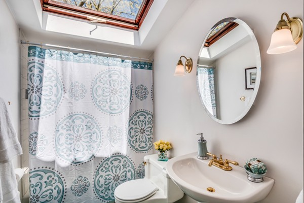 17 Tamarac Road Newton, MA 02464 - Photo 20 of 29 a bathroom with a toilet sink and mirror