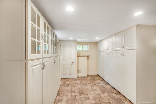 17 Tamarac Road Newton, MA 02464 - Photo 26 of 29 a view of a hallway with wooden shelves