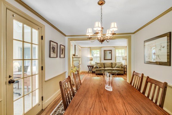 17 Tamarac Road Newton, MA 02464 - Photo 7 of 29 a view of a dining room with furniture a chandelier and wooden floor