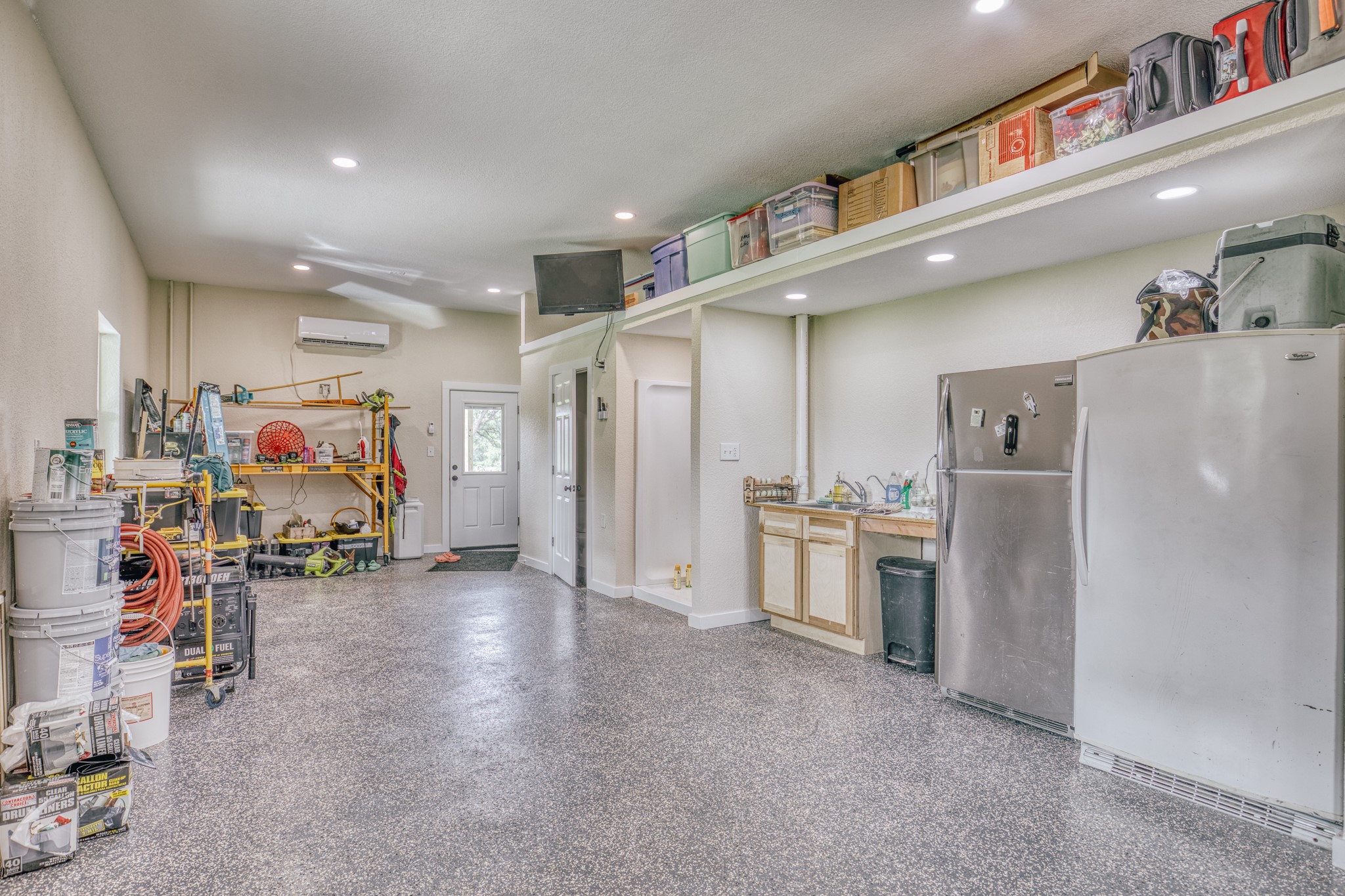 38261 Fm 1736 Road Hempstead, TX 77445 - Photo 32 of 43 Incredible garage/shop. Epoxy flooring. AC, sink