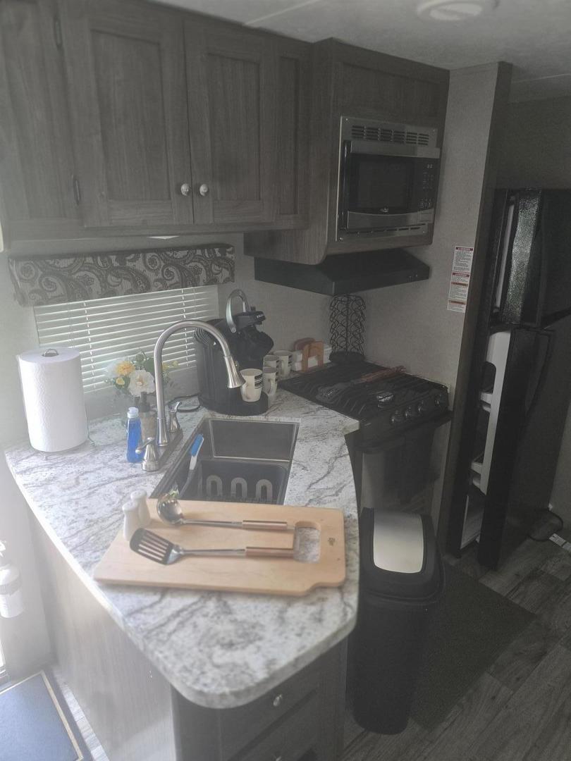 24-22 Woodhaven Sublette, IL 61367 - Photo 12 of 24 a kitchen with a sink and cabinets