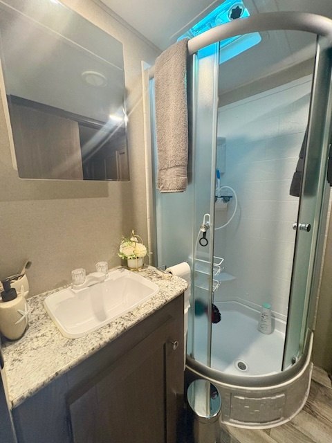 24-22 Woodhaven Sublette, IL 61367 - Photo 20 of 24 a bathroom with a sink and a mirror