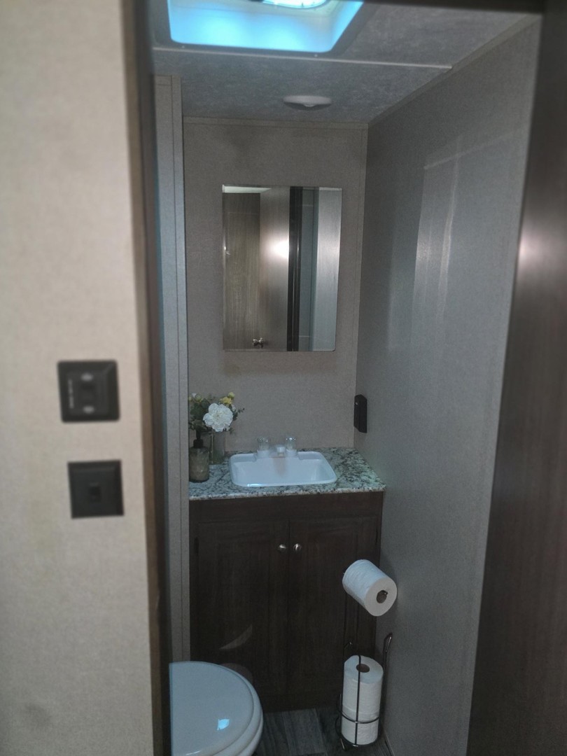24-22 Woodhaven Sublette, IL 61367 - Photo 22 of 24 a bathroom with a granite countertop toilet sink and mirror