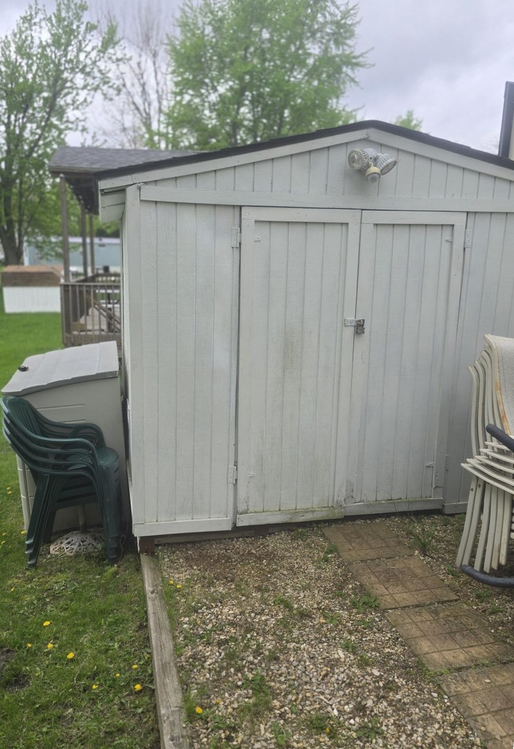 24-22 Woodhaven Sublette, IL 61367 - Photo 6 of 24 a backyard of a house with table and chairs