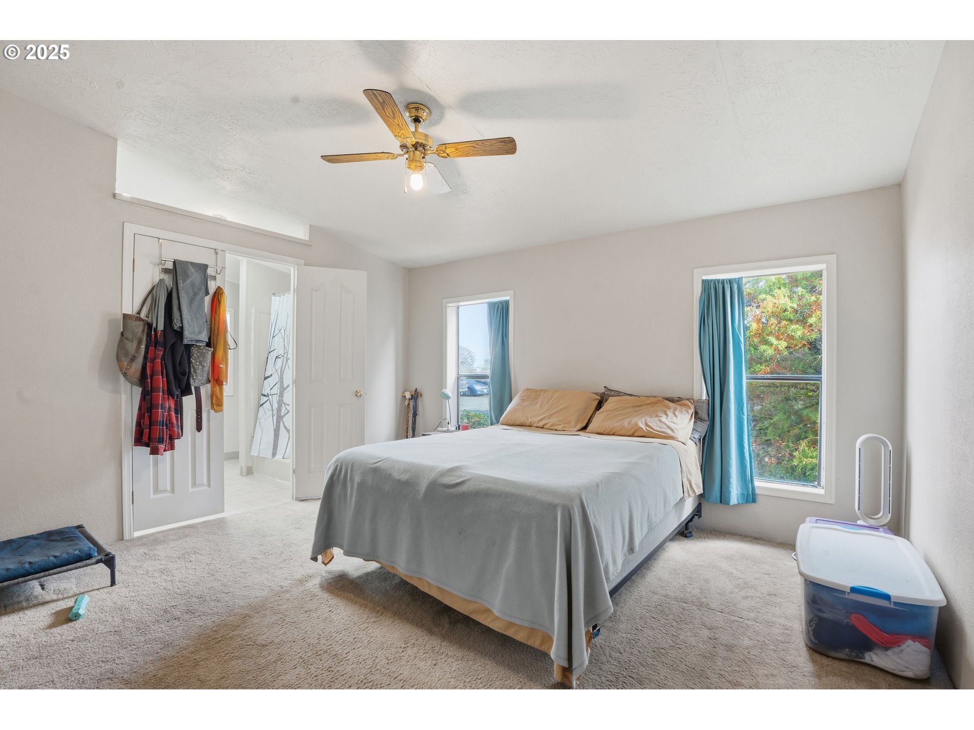 1949 Southeast Palmquist Road, Unit 32 Gresham, OR 97080 - Photo 13 of 31 a bedroom with a bed and a window