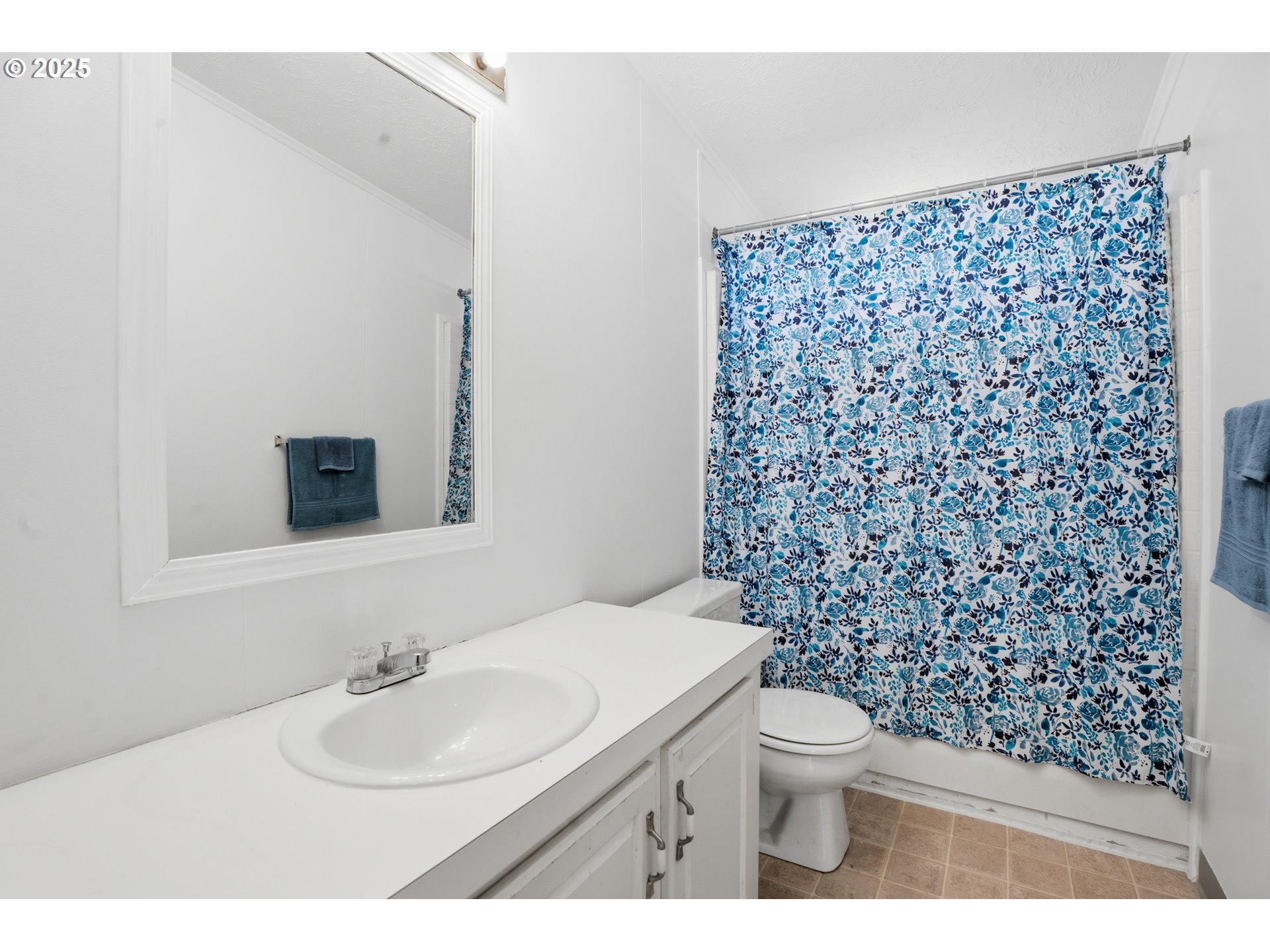 1949 Southeast Palmquist Road, Unit 32 Gresham, OR 97080 - Photo 16 of 31 a bathroom with a sink toilet and mirror
