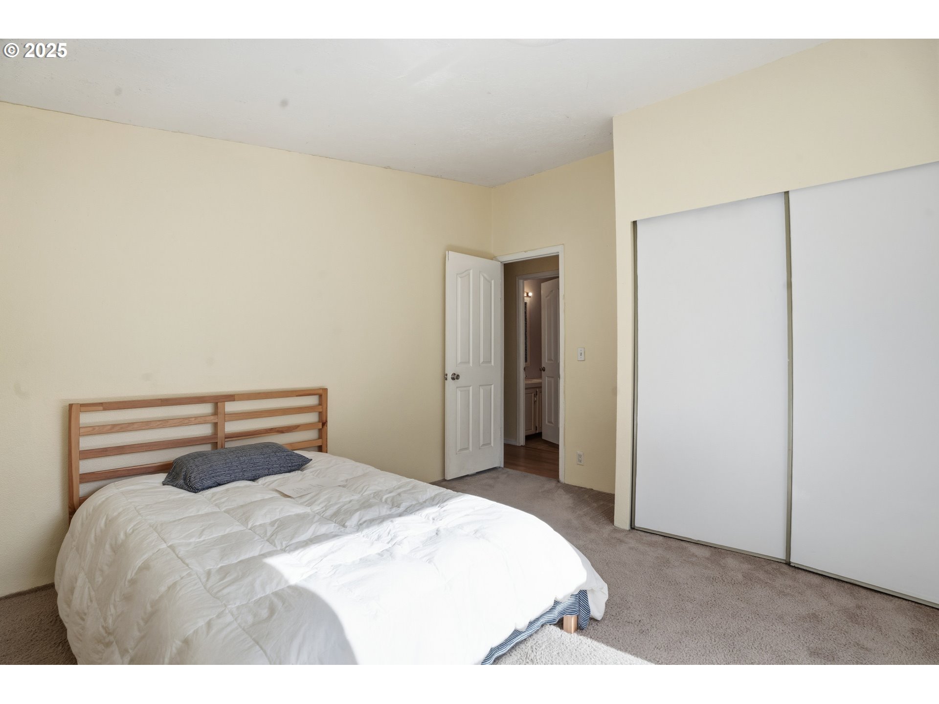 1949 Southeast Palmquist Road, Unit 32 Gresham, OR 97080 - Photo 17 of 31 a bedroom with a bed and a cabinets