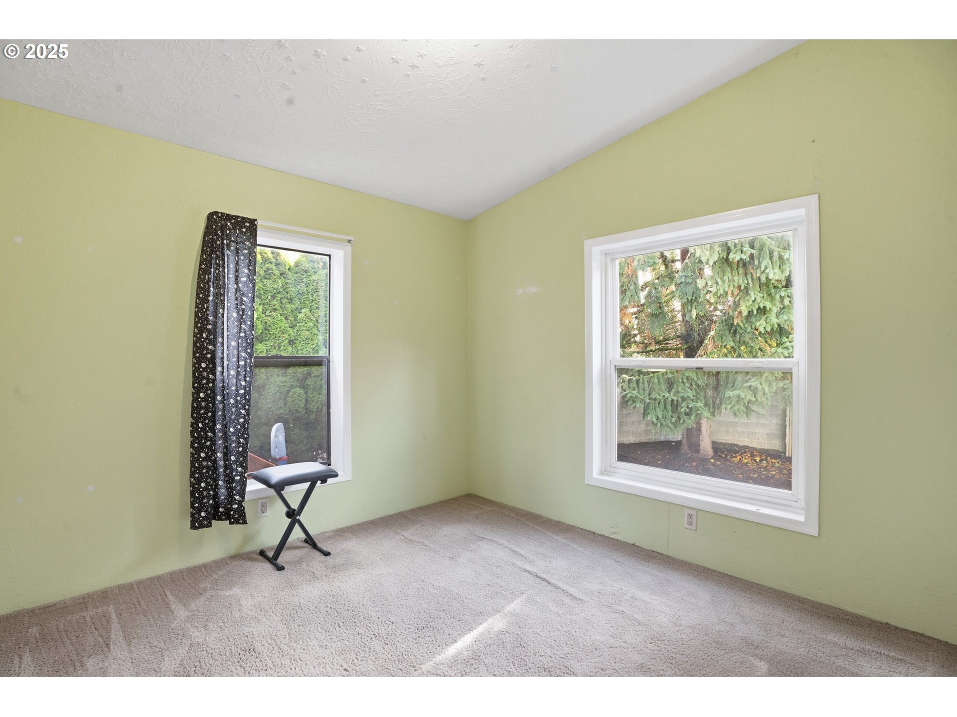 1949 Southeast Palmquist Road, Unit 32 Gresham, OR 97080 - Photo 20 of 31 a view of an empty room with a window