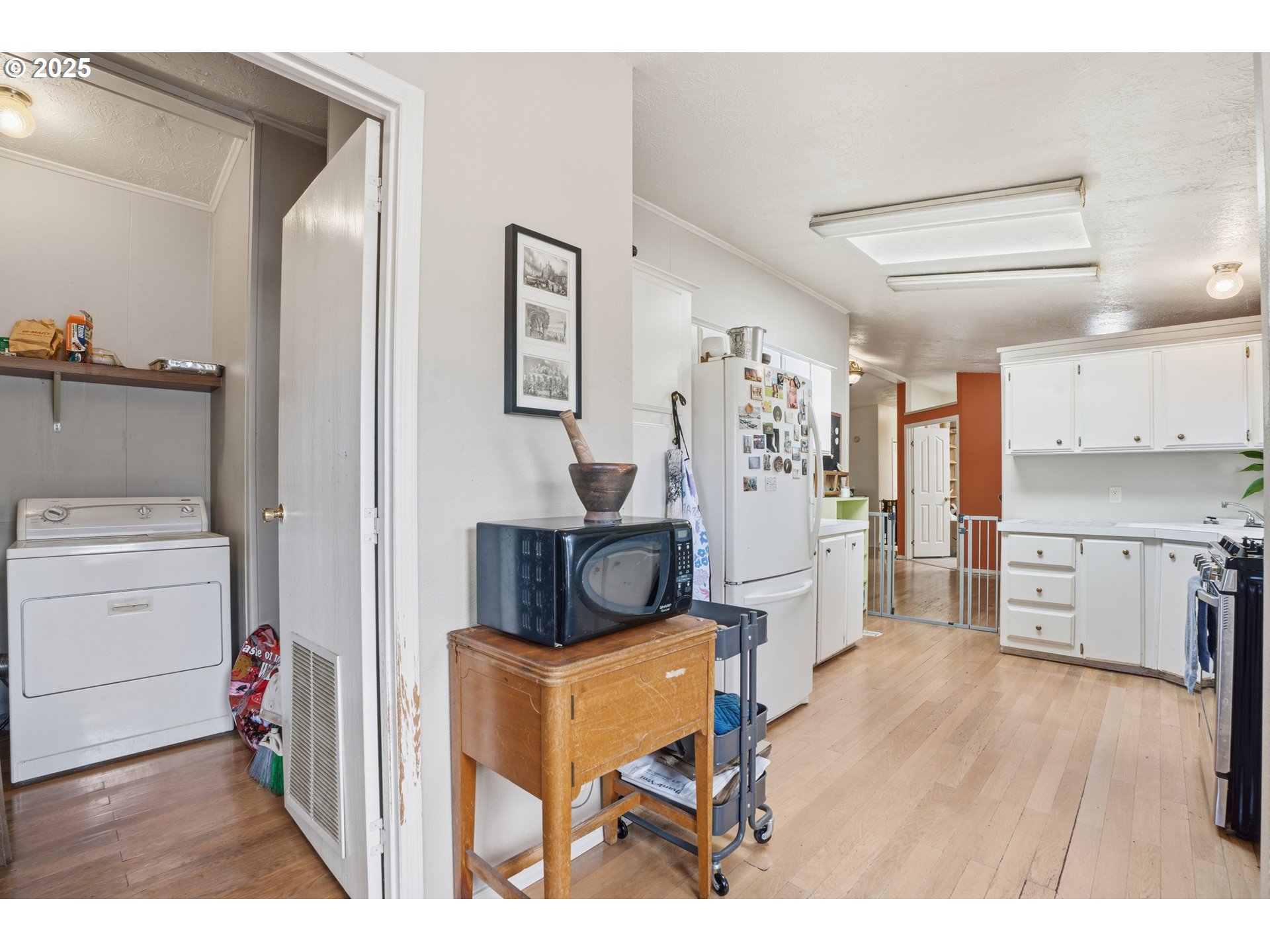 1949 Southeast Palmquist Road, Unit 32 Gresham, OR 97080 - Photo 22 of 31 a living room with furniture and a wooden floor