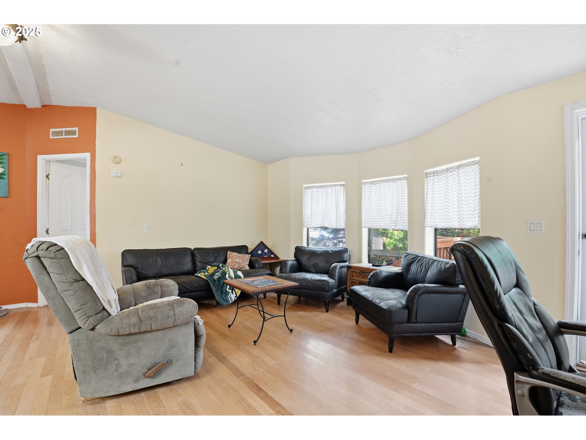 1949 Southeast Palmquist Road, Unit 32 Gresham, OR 97080 - Photo 4 of 31 a living room with furniture and a large window