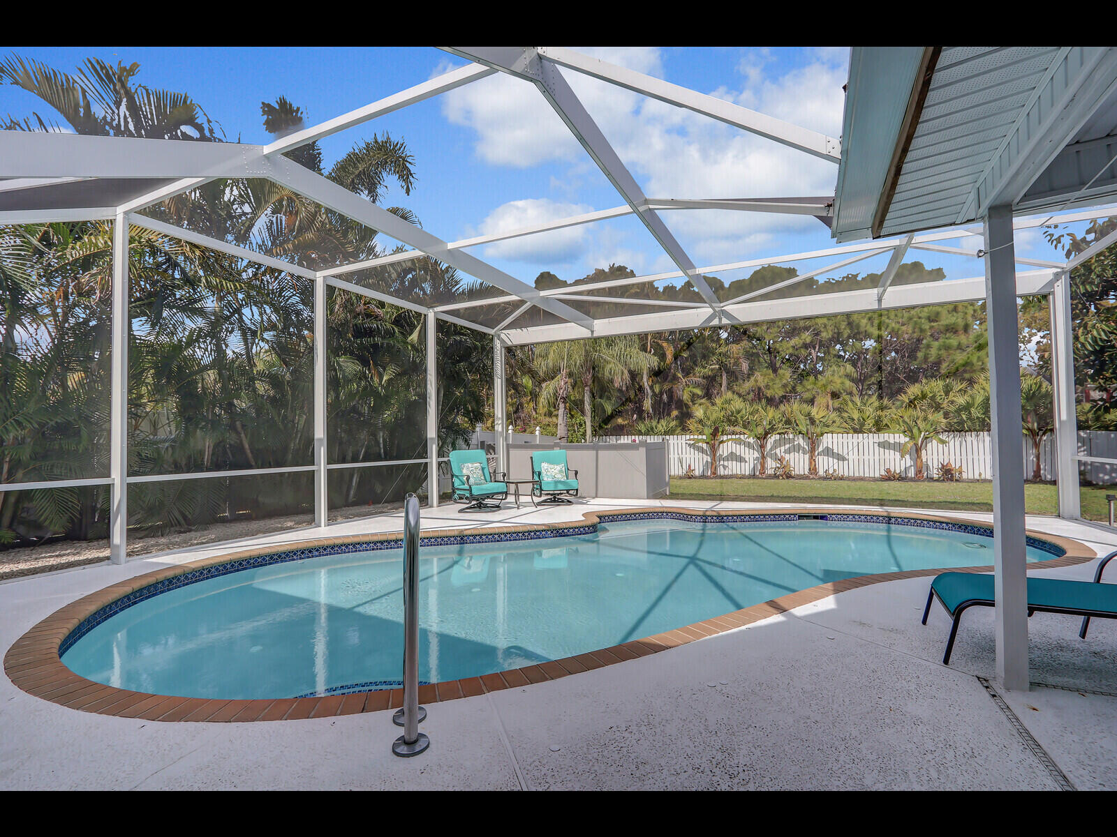 609 Oak Terrace Jupiter, FL 33458 - Photo 24 of 28 a view of a swimming pool with a porch