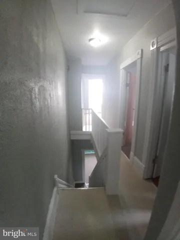 a view of entryway and hall with a window