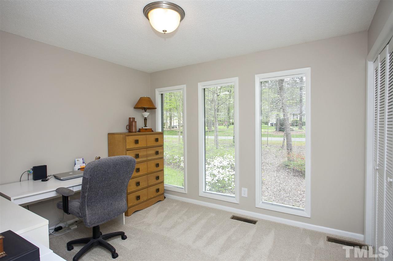 9605 Rock Creek Road Raleigh, NC 27613 - Photo 13 of 25 a workspace with furniture and a window