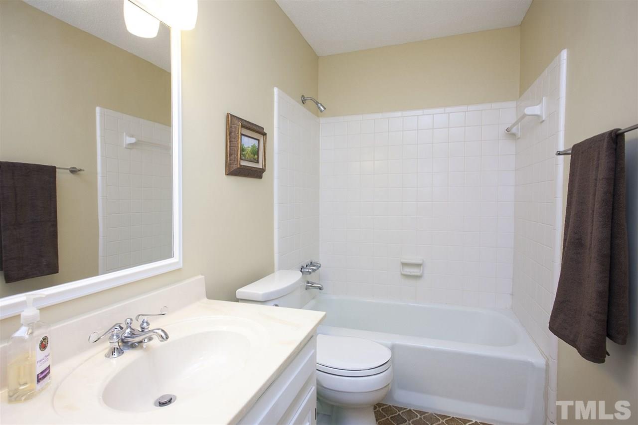 9605 Rock Creek Road Raleigh, NC 27613 - Photo 14 of 25 a bathroom with a sink toilet and shower