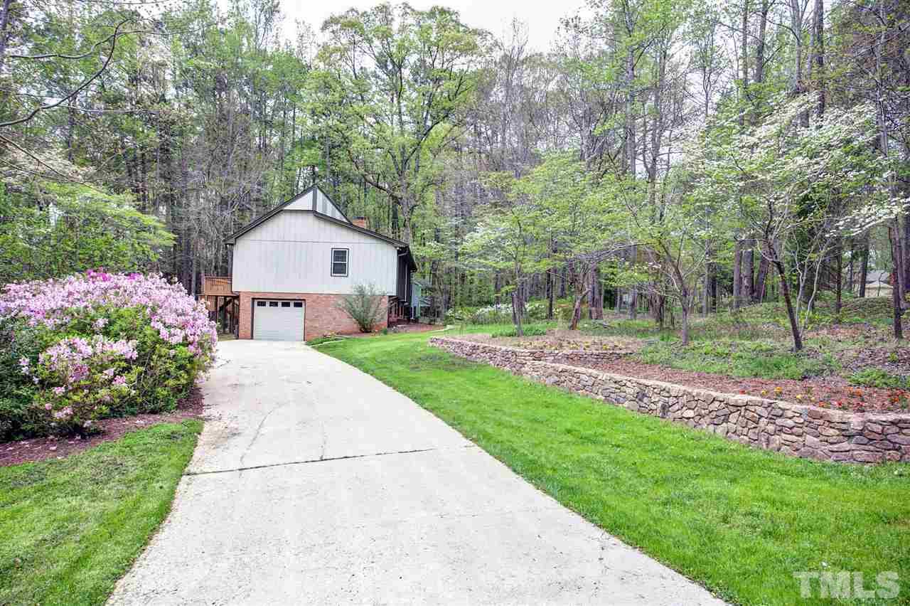 9605 Rock Creek Road Raleigh, NC 27613 - Photo 3 of 25 a front view of a house with garden