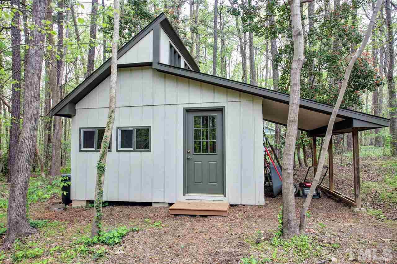 9605 Rock Creek Road Raleigh, NC 27613 - Photo 22 of 25 a view of a house with a yard