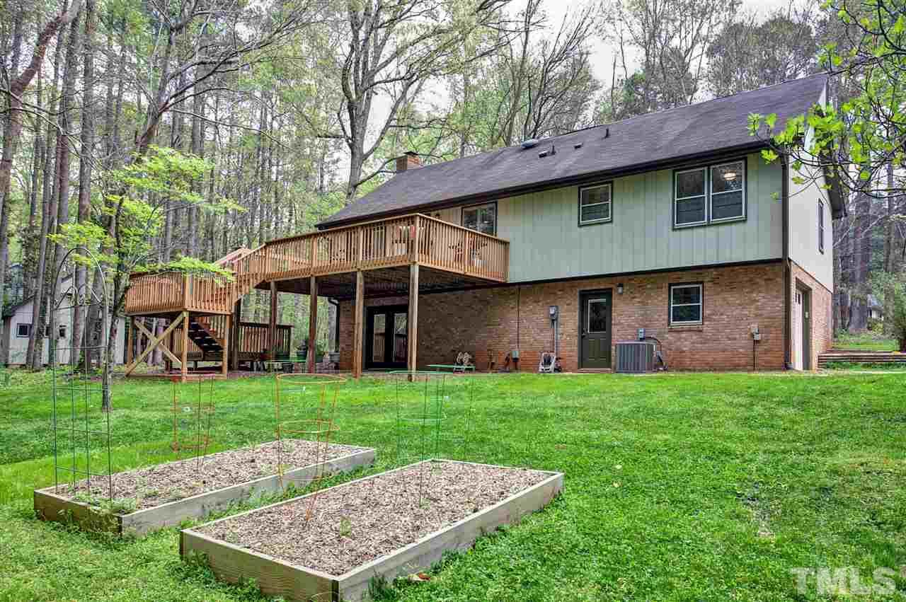 9605 Rock Creek Road Raleigh, NC 27613 - Photo 23 of 25 a view of a back yard of the house