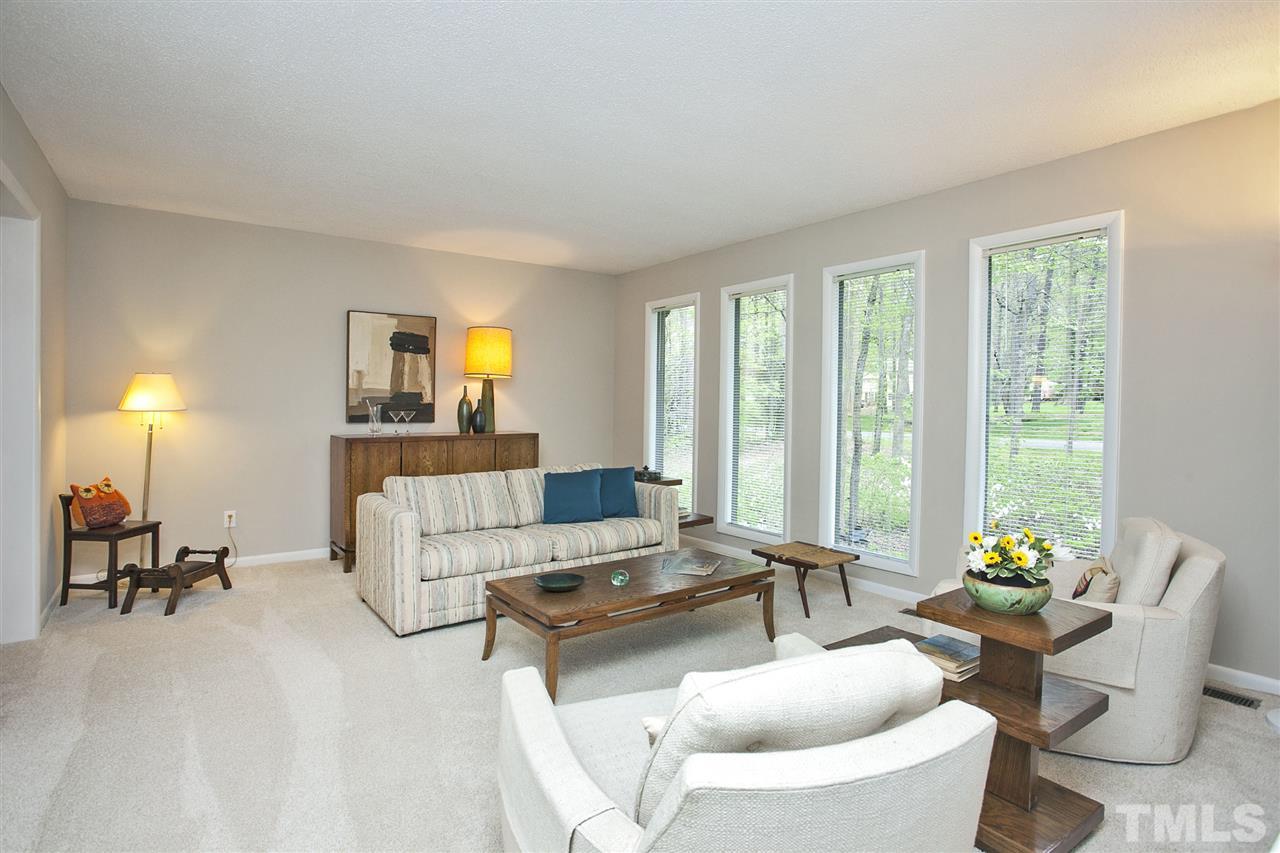 9605 Rock Creek Road Raleigh, NC 27613 - Photo 7 of 25 a living room with furniture and a large window
