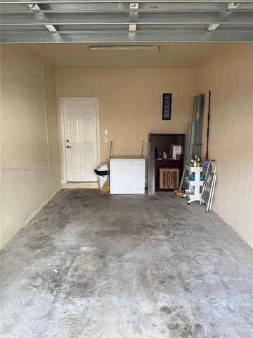 a view of empty room with furniture and a ceiling fan