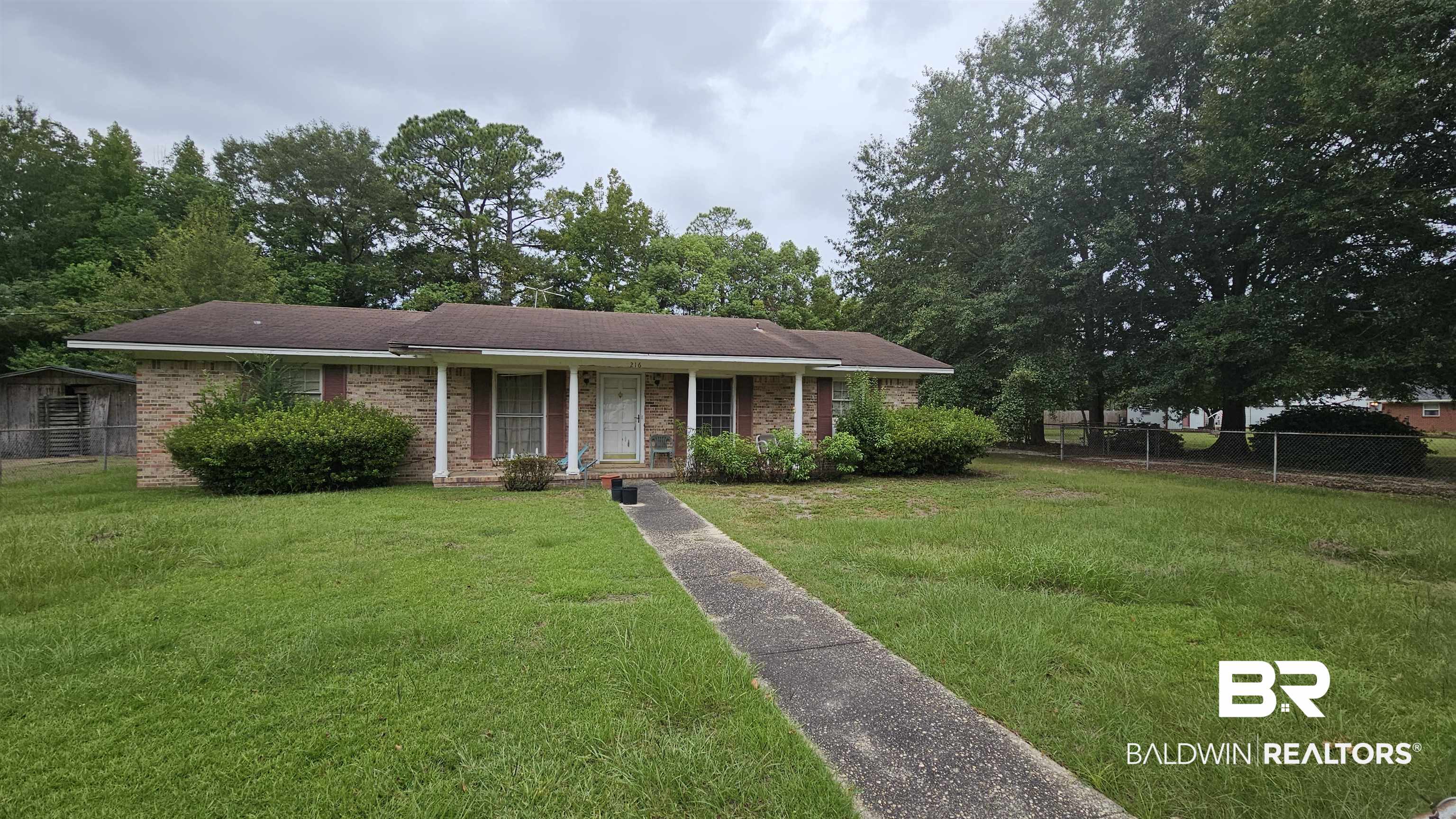 216 6th Avenue Atmore, AL 36502 - Photo 34 of 34 Ranch-style home featuring a front lawn
