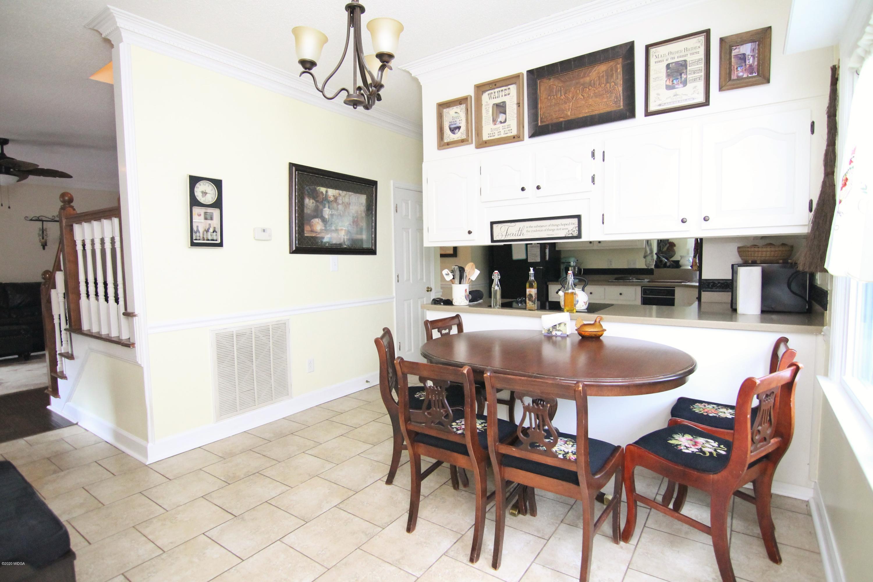 205 Cedar Ridge Drive Perry, GA 31069 - Photo 11 of 39 a dining room with furniture and window