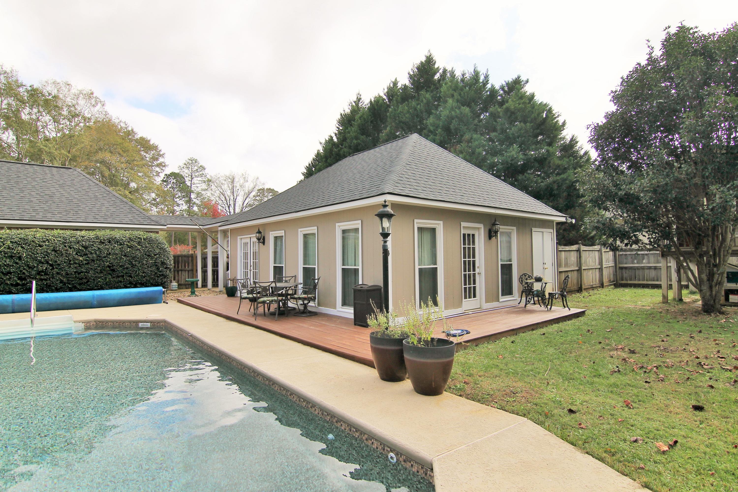 205 Cedar Ridge Drive Perry, GA 31069 - Photo 29 of 39 a view of a house with a yard patio and fire pit