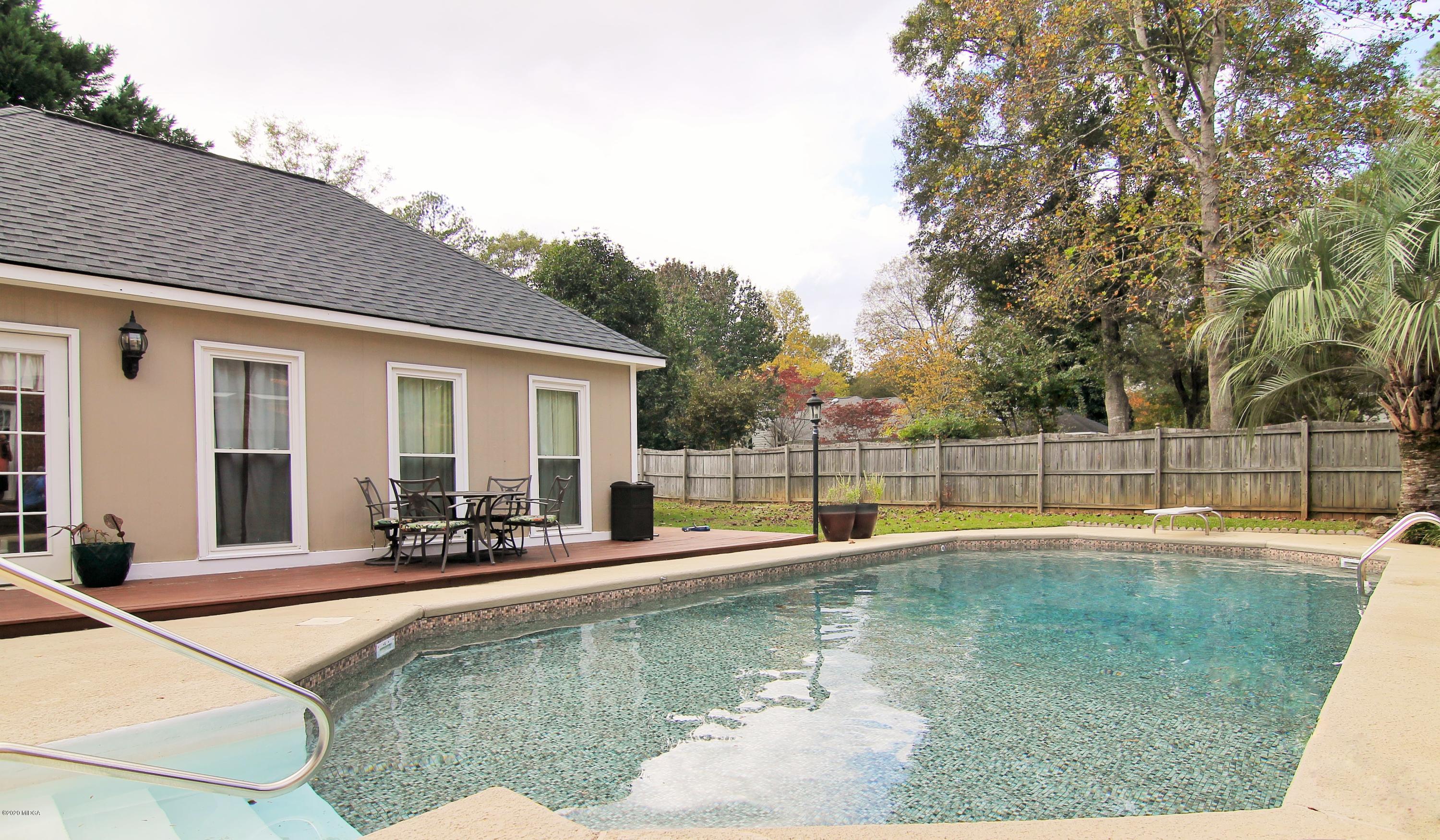 205 Cedar Ridge Drive Perry, GA 31069 - Photo 36 of 39 a view of a house with swimming pool and sitting area