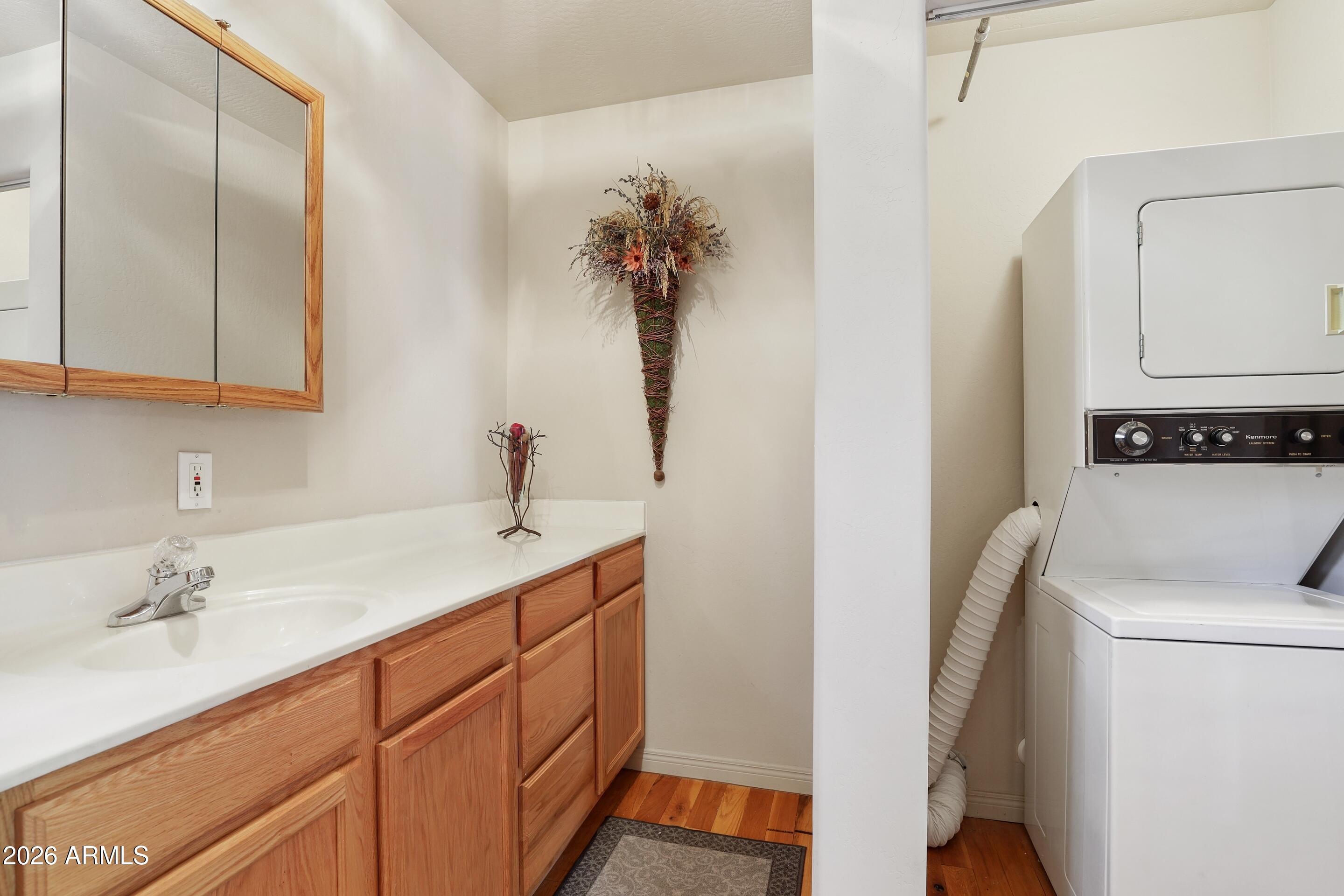 5837 Arroyo Way Pine, AZ 85544 - Photo 14 of 30 a bathroom with a sink a toilet and a mirror