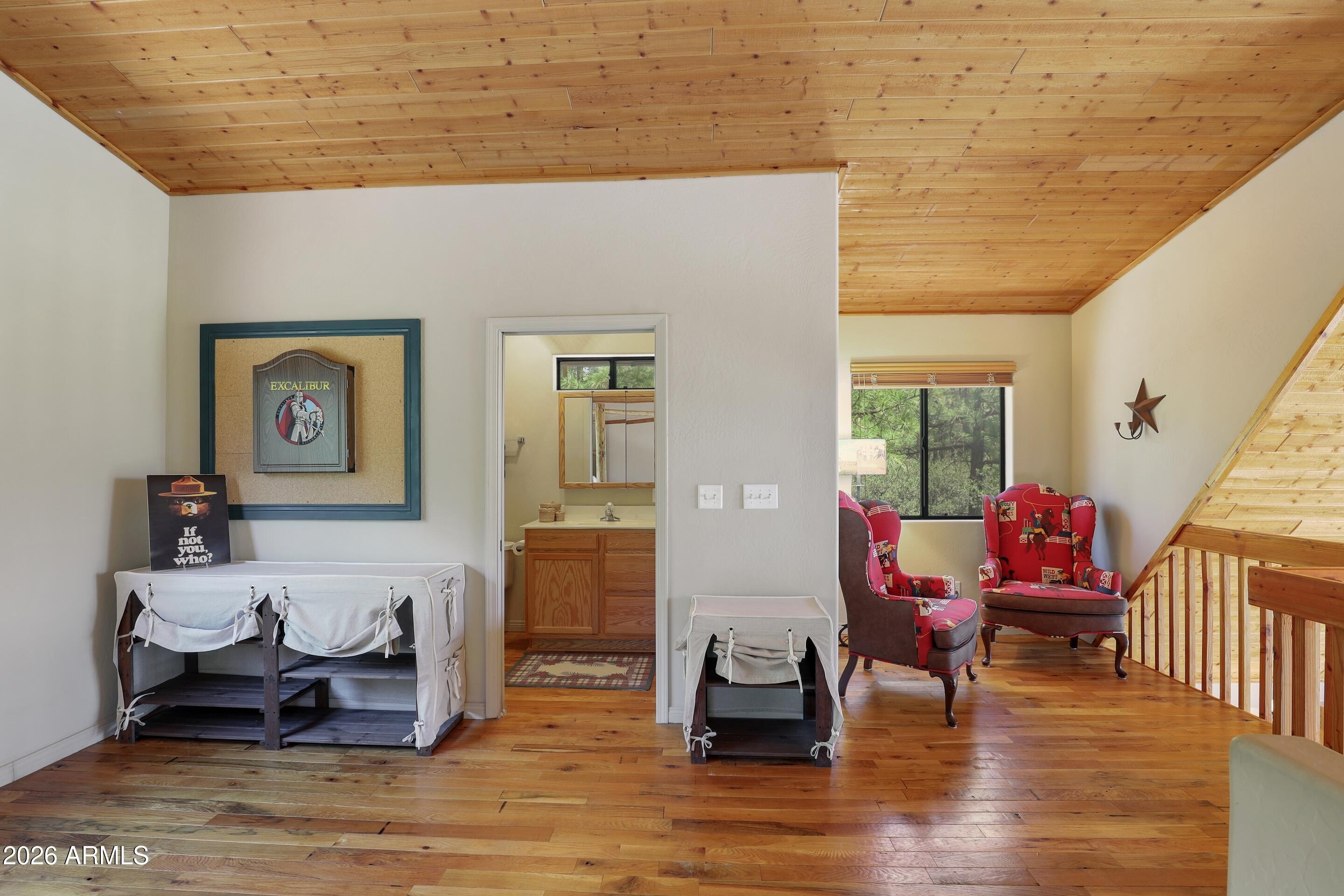 5837 Arroyo Way Pine, AZ 85544 - Photo 16 of 30 a living room with furniture and wooden floor