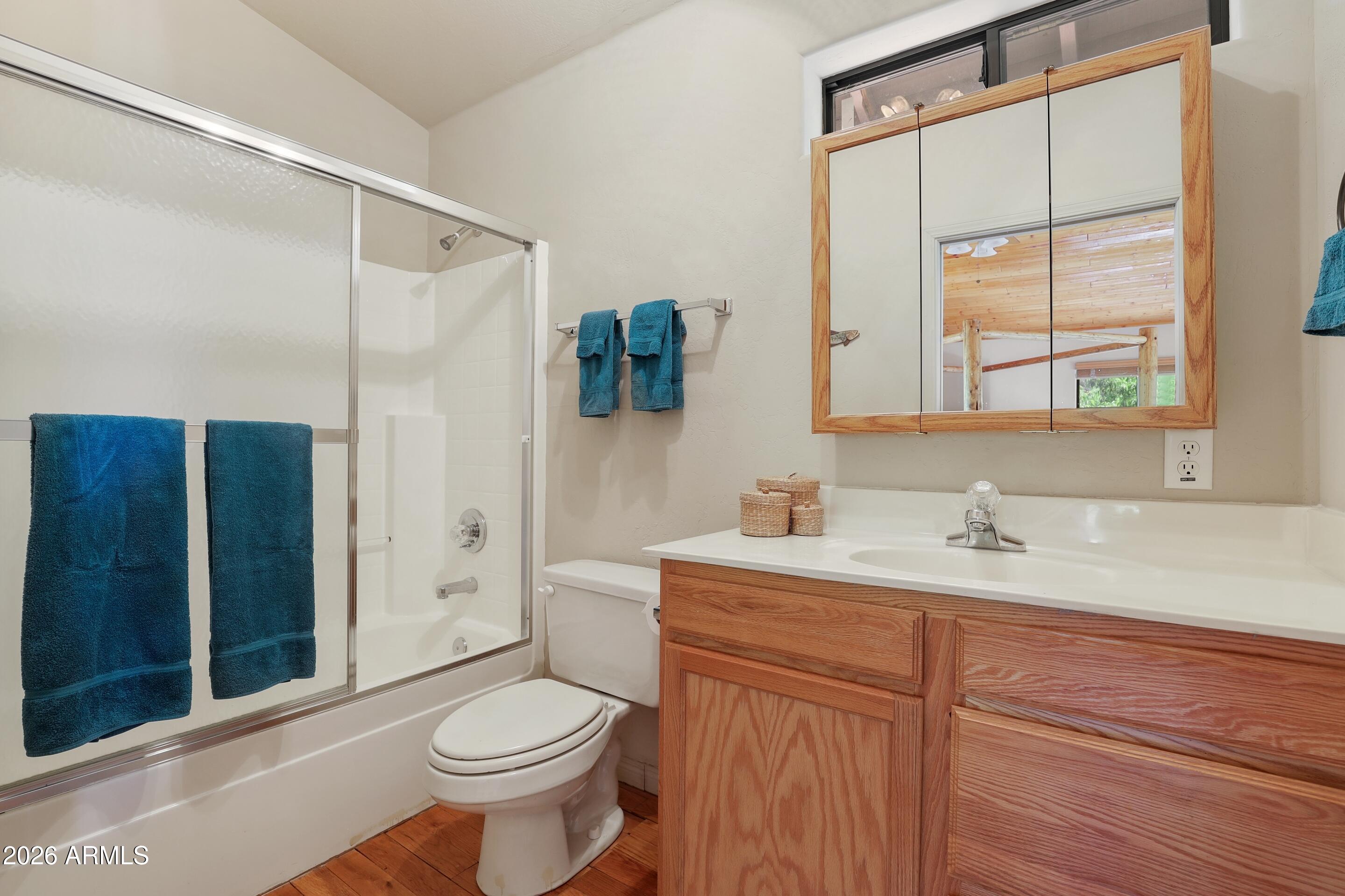 5837 Arroyo Way Pine, AZ 85544 - Photo 18 of 30 a bathroom with a sink toilet and shower