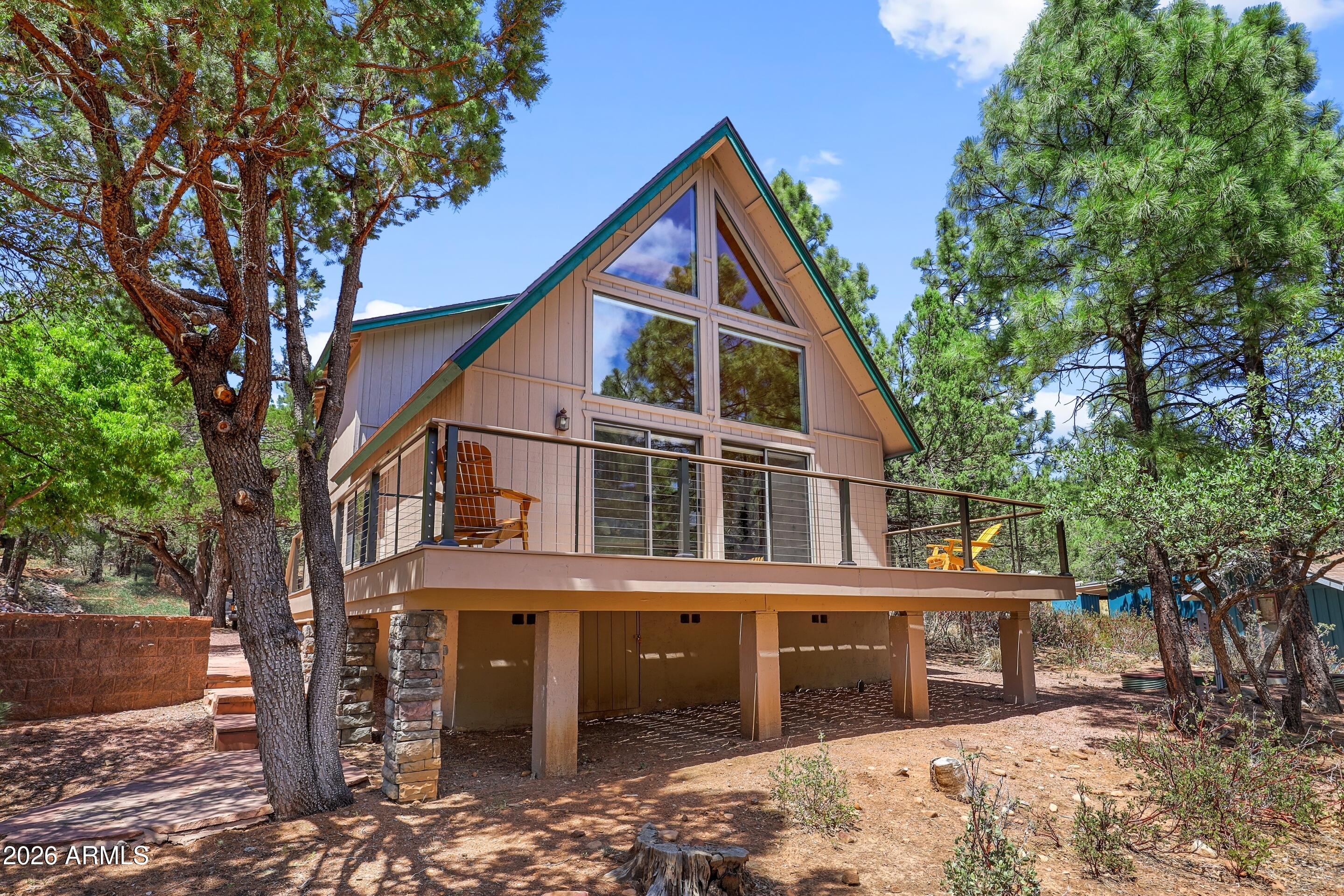 5837 Arroyo Way Pine, AZ 85544 - Photo 19 of 30 a view of a house with a yard