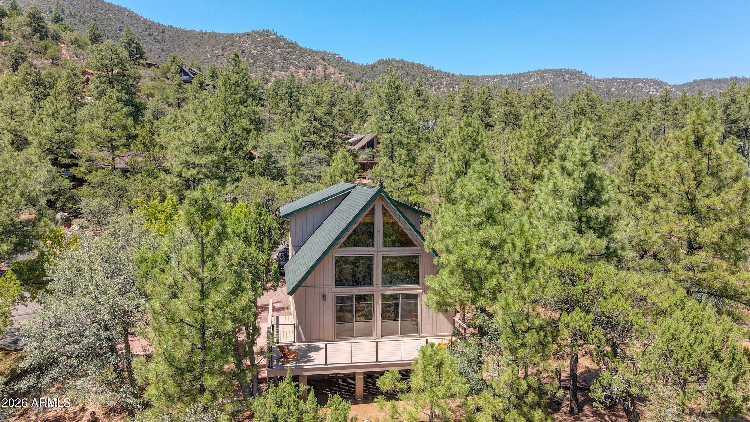 5837 Arroyo Way Pine, AZ 85544 - Photo 23 of 30 a aerial view of a house with a mountain