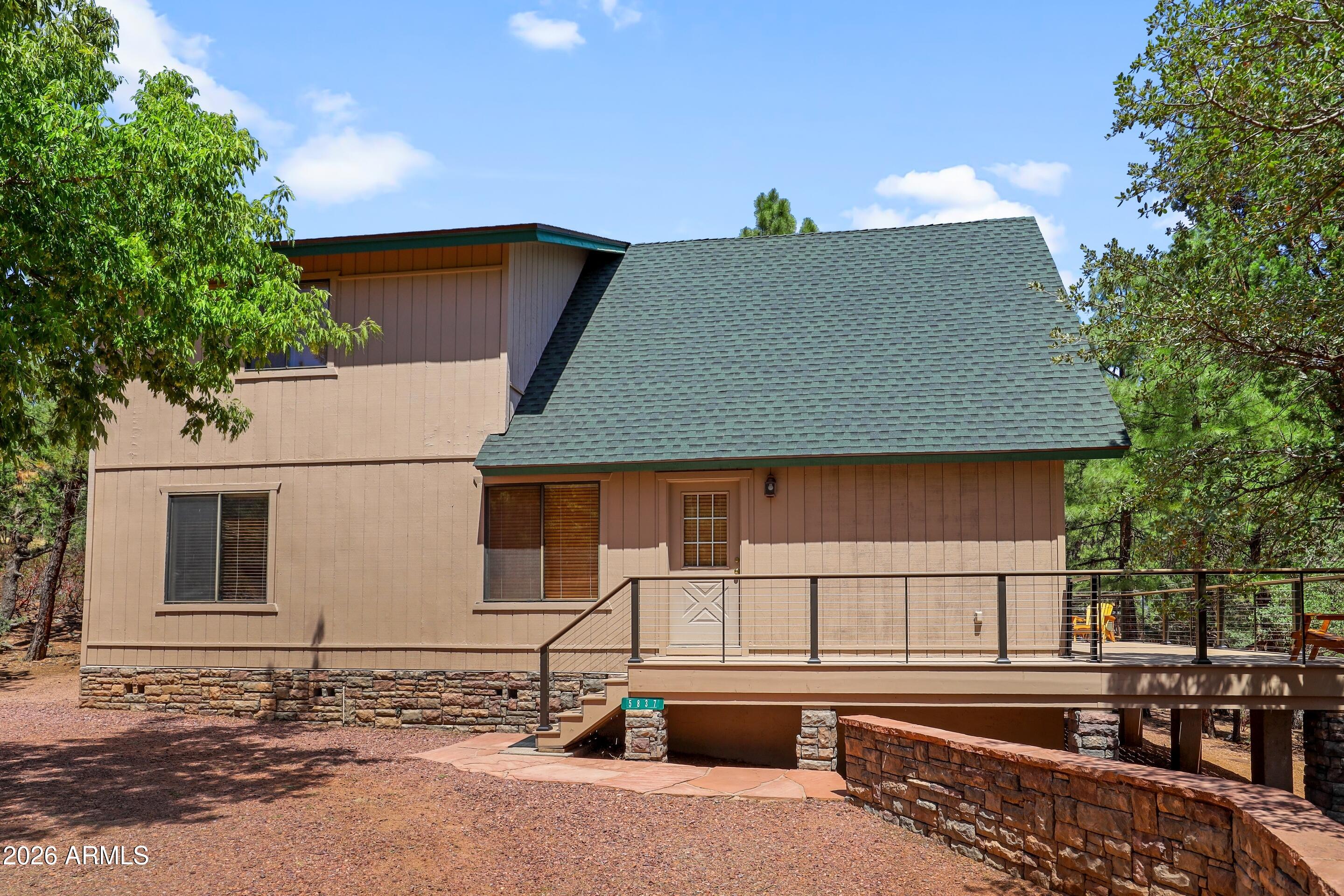 5837 Arroyo Way Pine, AZ 85544 - Photo 27 of 30 a front view of a house with yard
