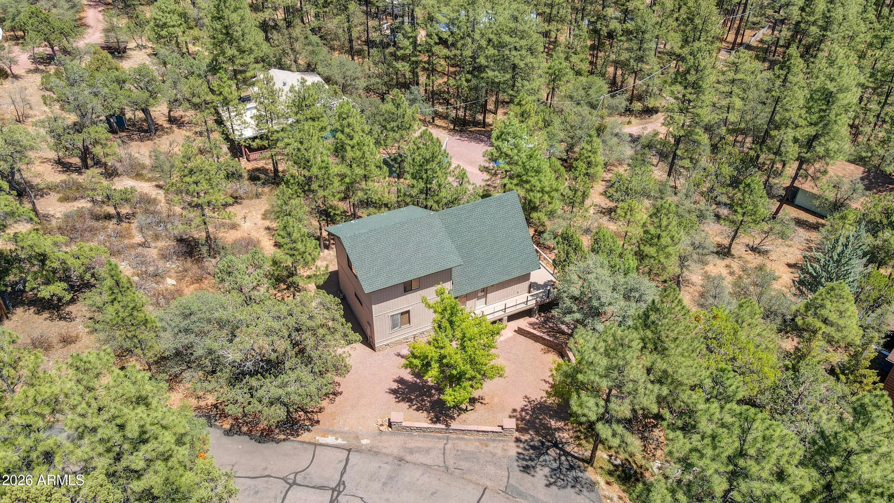 5837 Arroyo Way Pine, AZ 85544 - Photo 28 of 30 an aerial view of a house with yard and outdoor seating