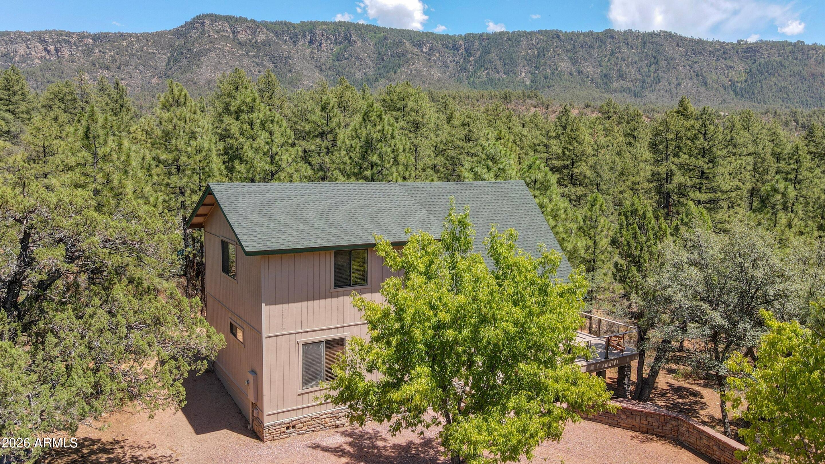 5837 Arroyo Way Pine, AZ 85544 - Photo 29 of 30 a view of a house with a yard