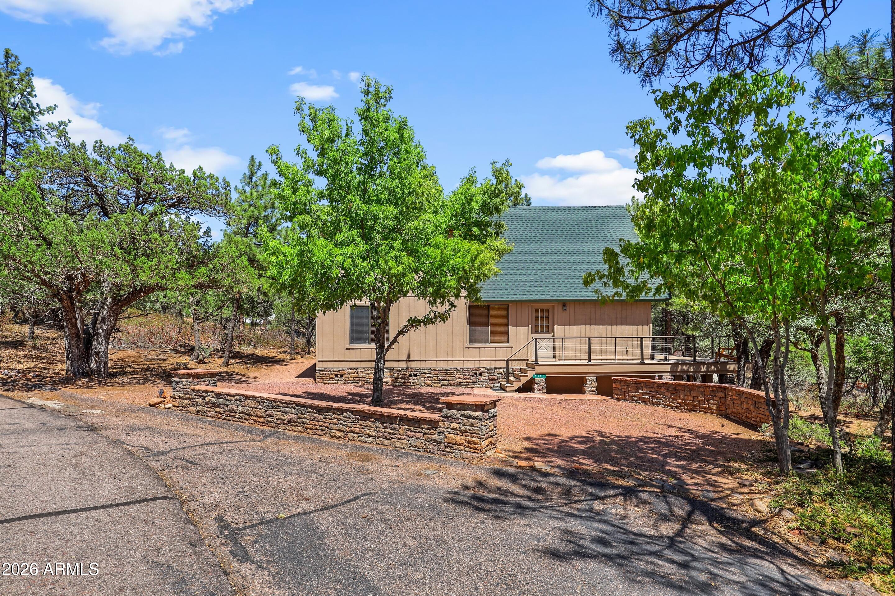 5837 Arroyo Way Pine, AZ 85544 - Photo 30 of 30 a outdoor space with lots of palm trees